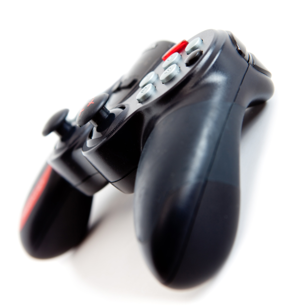 Black Video Game Controller Isolated Over A White Background